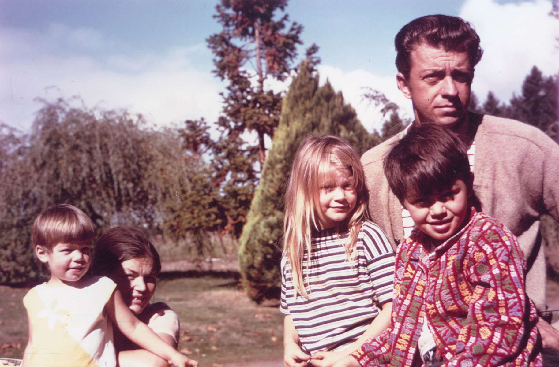 Man with four children outdoors